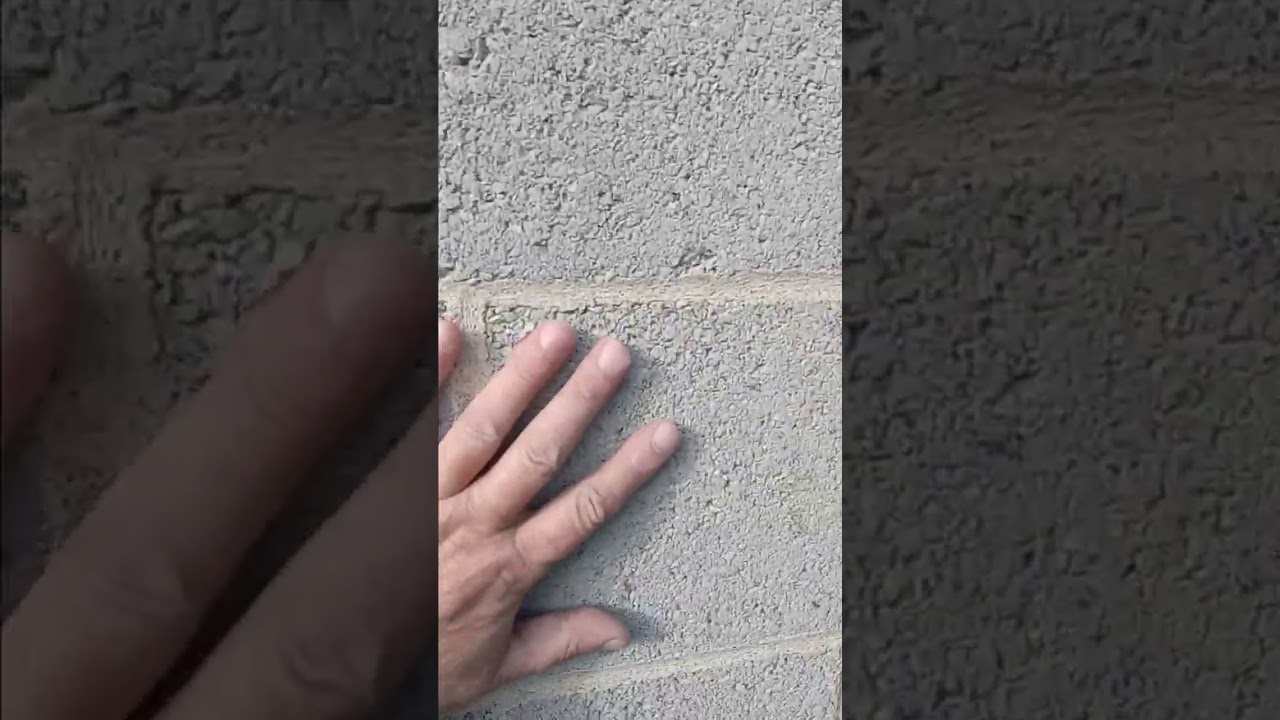 cinder block garage, applying sealer block filler product.