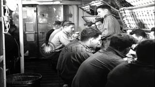 Sailors take their meal in a mess hall aboard USS Saufley underway in the Atlanti...HD Stock Footage