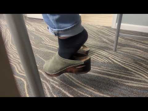 Dangling green suede clogs