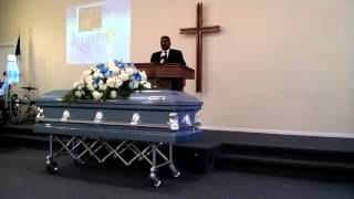 pastor Scott bringing the word at uncle Garys funeral