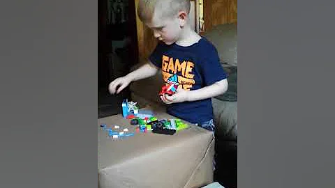 Declan at age 3 putting together his Spiderman leg...