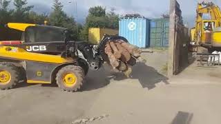 JCB 516-40 telehandler loader loading firewood with kellfri log grab/grapple/attachment
