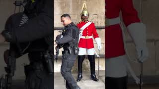 Armed Policeman protects the King’s Guard, #shorts