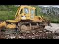 Aerial view of asphalt demolition dozer transformation from above