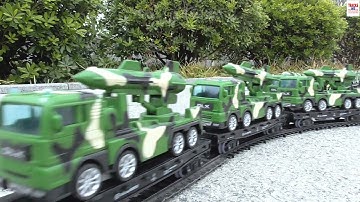 Stunning O Scale Model Train Carrying Massive Load Of Military Equipment To An Army Camp