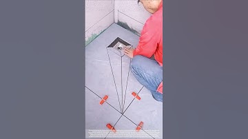 Three-dimensional "diamond" shaped floor drain tile installation technique.