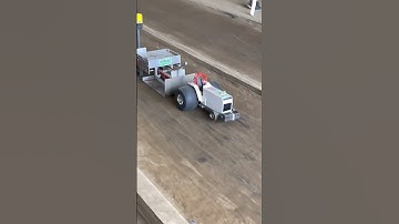 CASE RC tractor pulling a heavy sled