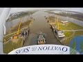 Cruise ship Ovation of the Seas on river: 400m tug boat formation navigating the river Ems