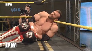 Wrestling low blow on Nick Aldis (Magnus)