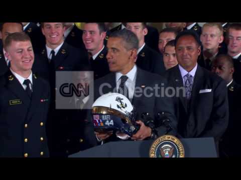 obama-gets-navy-football-helmet-(funny)