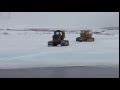 Bulldozer falls through ice