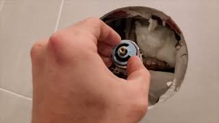 How to adjust temperature setting on Delta shower valve