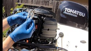 How to change the SPARK plugs on a TOHATSU outboard!!!!