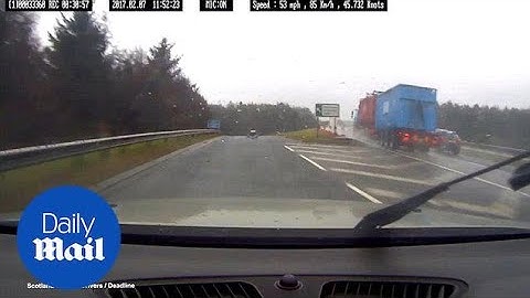 Moment driver goes in the wrong direction on a dual carriageway - Daily Mail