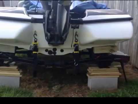 Lifting bass boat to change trailer bunks - YouTube