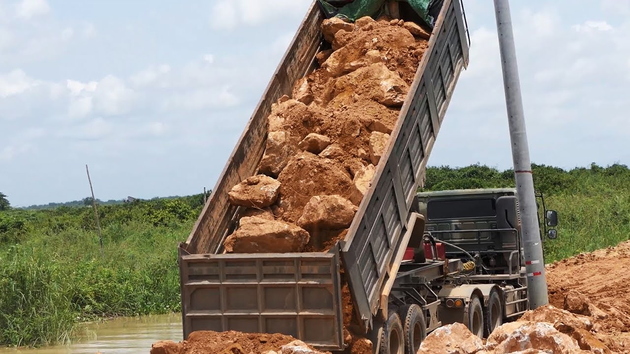 Experience Driver Moving Long Dump Truck Unloading Big Rock On Bad Road ...