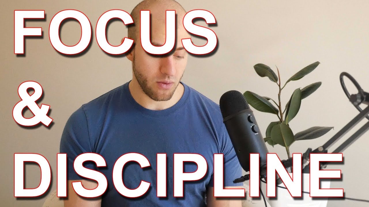  A bald man wearing a blue shirt is sitting in front of a microphone with a plant in the background, and the words 'Focus & Discipline' are overlaid on the image.
