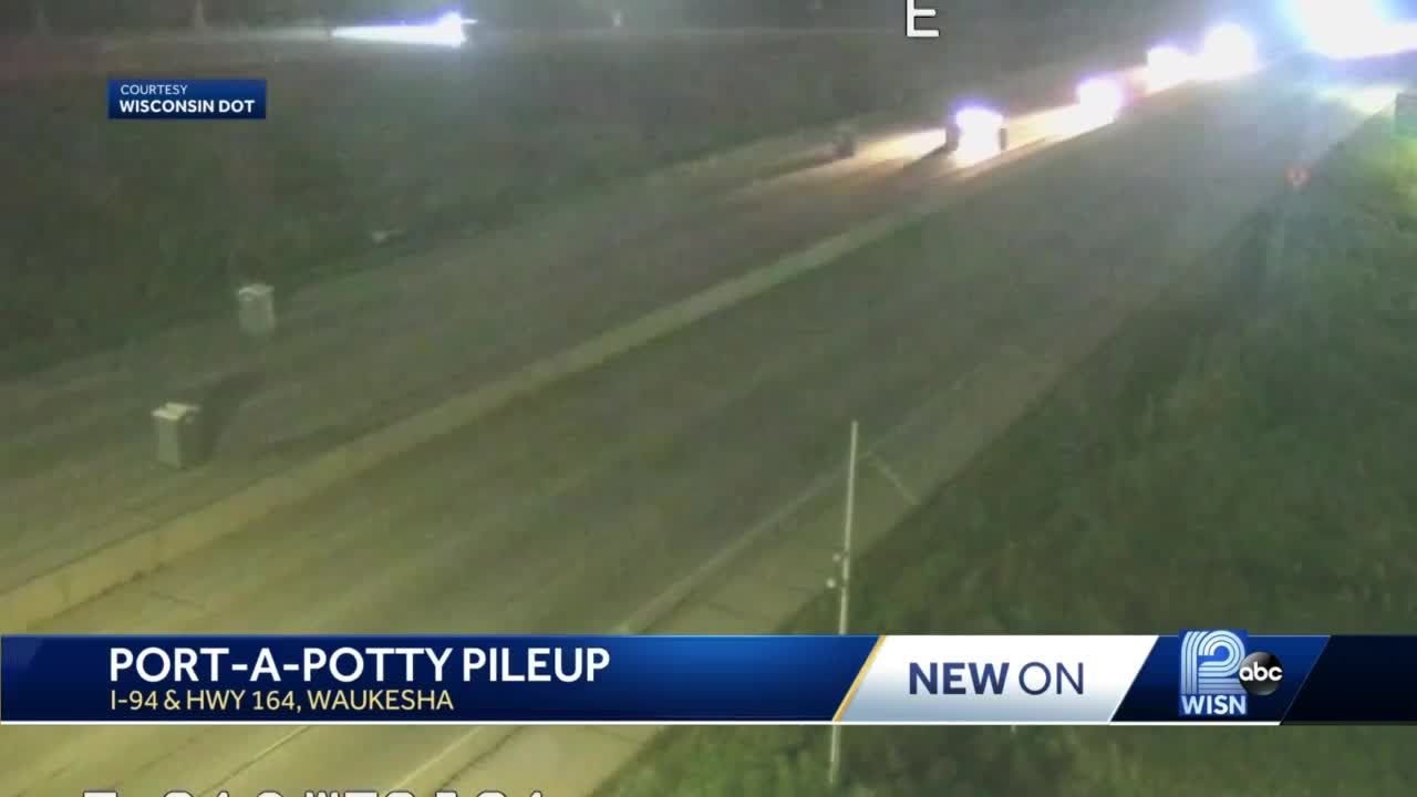 Port-a-potties  damage cars on I-94