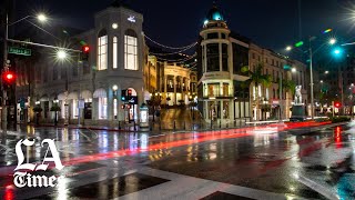 Days after the "safer at home" ordinance was enacted to help slow
spread of coronavirus, rodeo drive in beverly hills is empty people
and many sho...