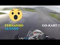 Fernando alonso driving gokart on wet track