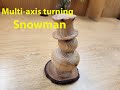 Turning a multi-axis snowman from a cedar branch