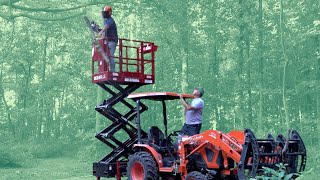 compact man lift on compact tractor! cut tree branches safely!