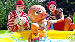 Mimes play with an inflatable doll in a children's video.