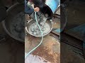 How does a small ball mill discharge material?