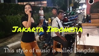 Download Lagu 👍 Local girl sings Dangdut music at 2am on the Jakarta streets of Indonesia MP3 Download Lagu 👍 Local girl sings Dangdut music at 2am on the Jakarta streets of Indonesia MP3