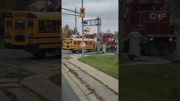 School Bus Comes Uncomfortably Close to Train || ViralHog