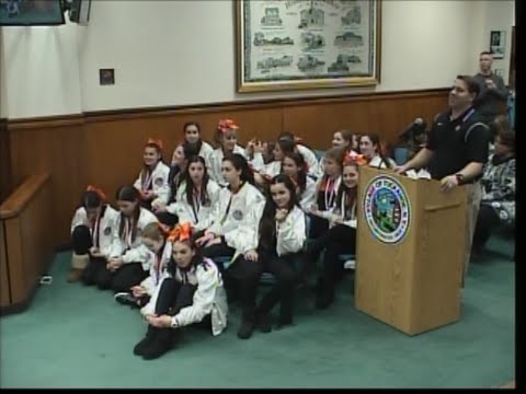 <p>Eastchester Councilman Luigi Marcoccia awarded the national champion Tuckahoe Tiger cheerleaders with certificates celebrating their achievement at the national championship.</p>