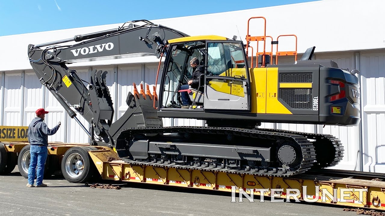 Loading Volvo EC200El Excavator on a trailer for transportation  YouTube