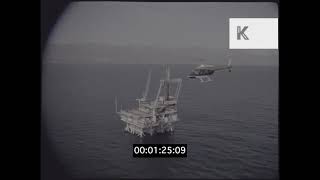 1979s UK Countryside POV Air To Air Helicopter Over Oil Rig