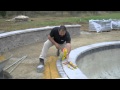 Laying pavers around pool coping