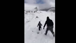 Dad saves kids in snow with Avengers Theme