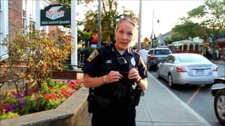 Officer confronted after threatening to strike photographer...