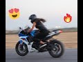 Cute girl riding a Super Bike