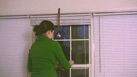 How to Decorate a Window With Christmas Ornaments