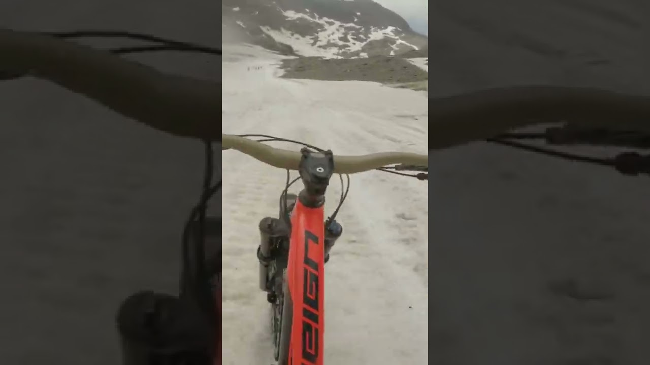 Getting loose Dropping into a steep snow chute!  