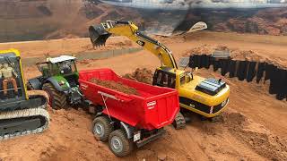 Rc excavator construction site earth excavation with truck and tractor. Constructionworld part1