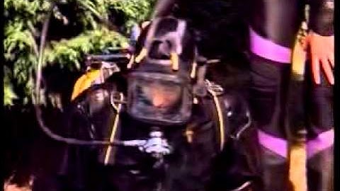 Woman diving in Avon neck entry drysuit