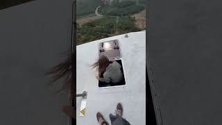 Person Captures the Majestic View While Scaling a Windmill