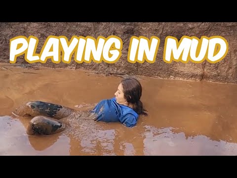 Girls have fun in mud