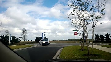 CITY OF ORLANDO PERMIT DEPARTMENT truck ignores the stop sign