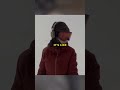 A Girl Snowboarding Does Not Realize a Bear is Behind Her