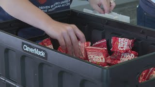 Volunteers pack more than 2,000 backpacks for students