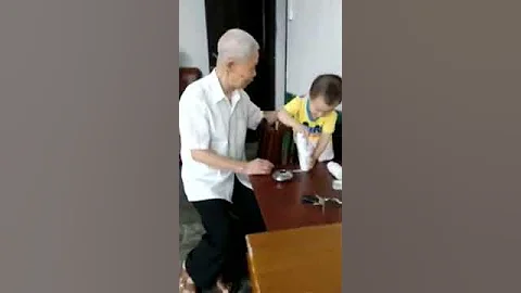 Grandfather and grandchildren are playing