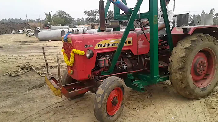 Excellent Tractor crane loading cement pipes