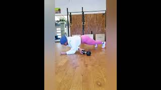Dumbbell plank pull through