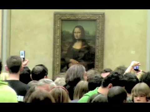 Admiring Mona Lisa by Leonardo da Vinci, Louvre Museum Paris, France, May 22nd, 2009